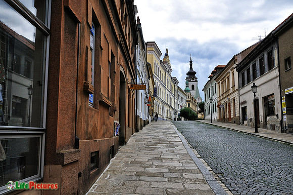 Pisek street with the church on the background