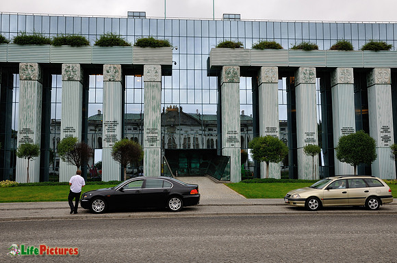 Reflections on the glass walls and business man
